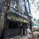 Fire tears through hotel in India’s capital in Delhi, killing at least 21 people as some jump from windows
